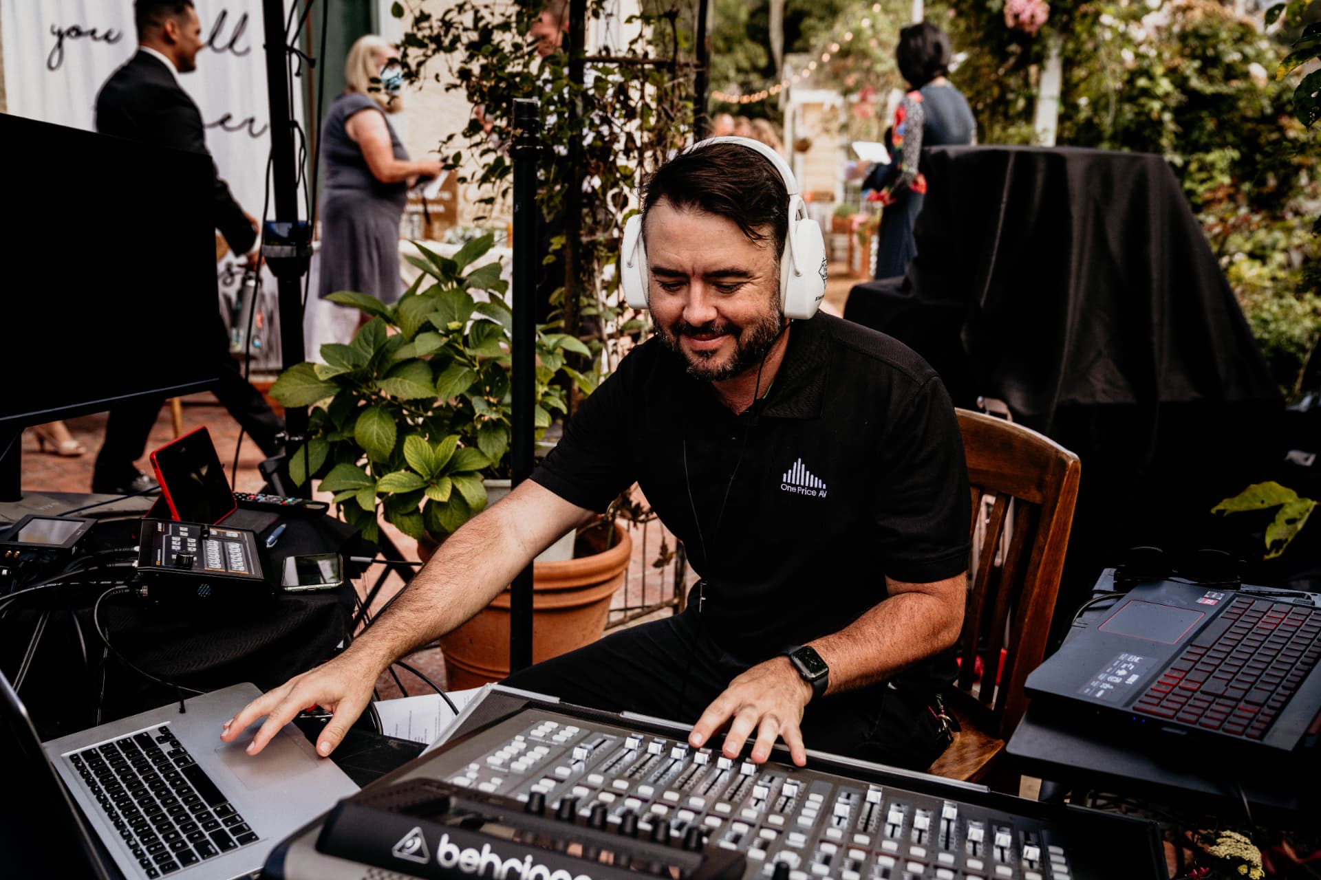 One Price AV engineer mixing audio at the console onsite